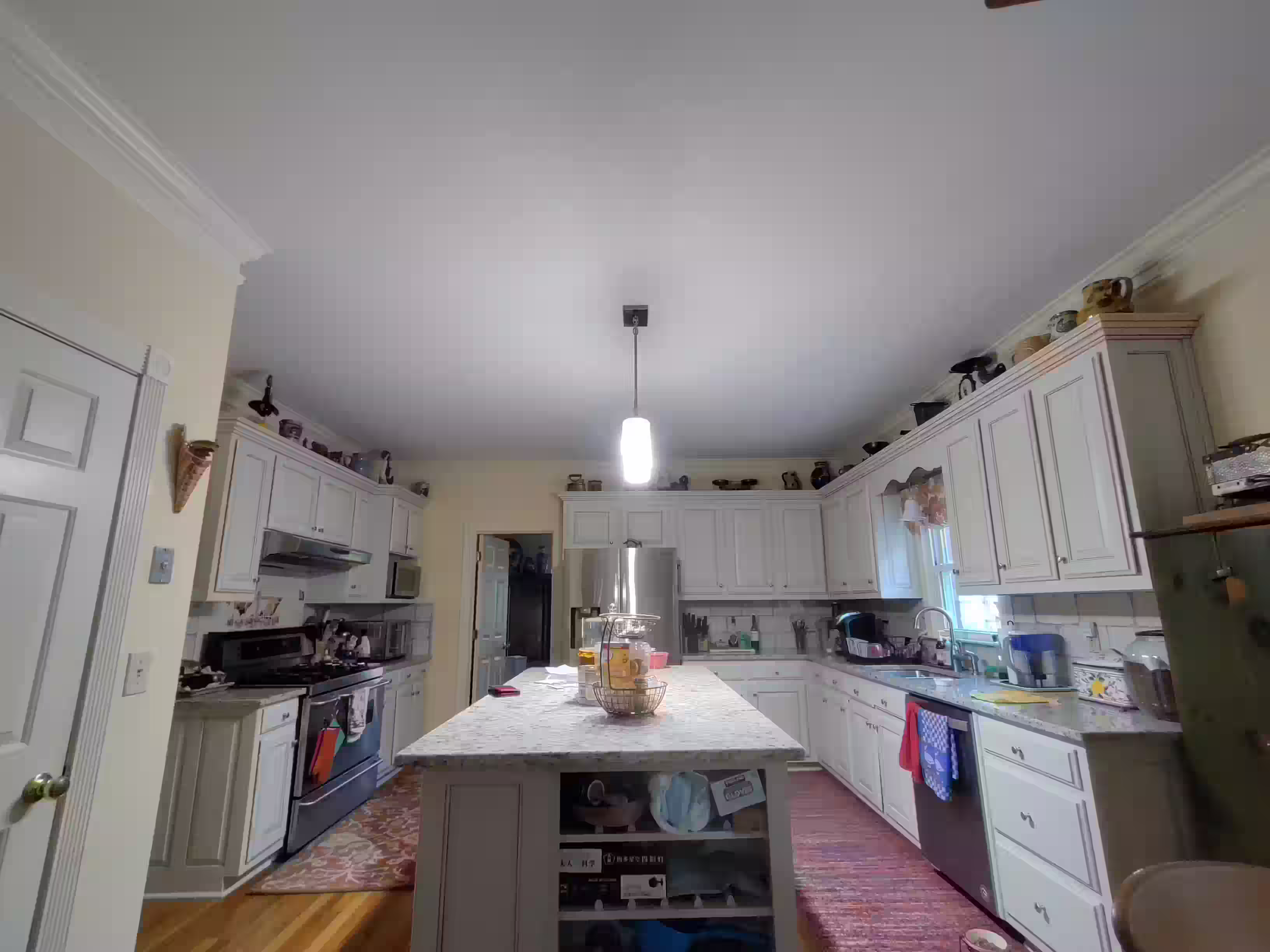 Kitchen and living area before renovation by Handy Daniel Services
