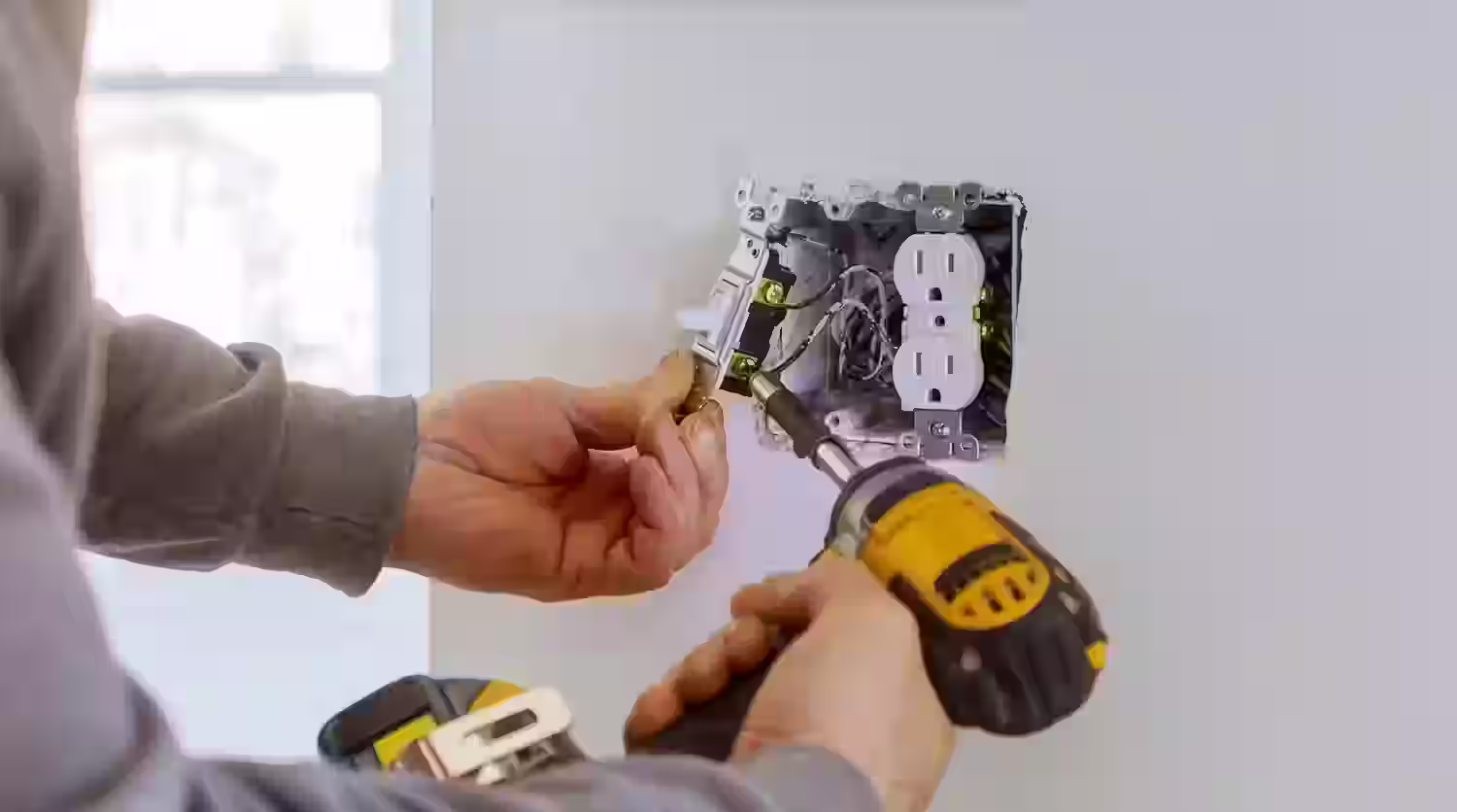GFCI outlet installation in kitchen and bathrooms for enhanced safety by Handy Daniel Services